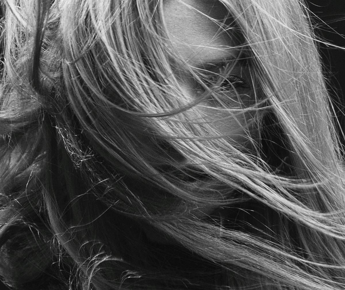 Close-up of twist maintenance routine showing Moisturized Hair with dewy sheen