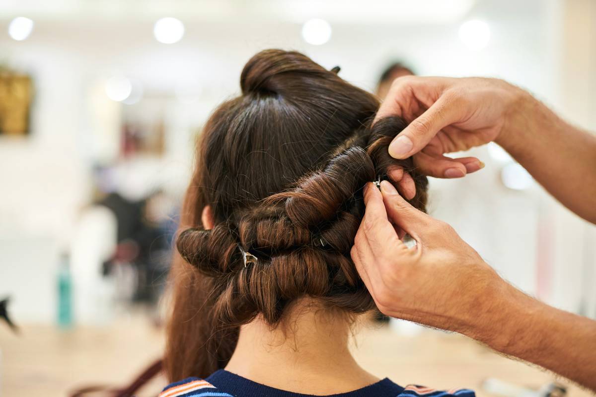 Close-up of neatly parted natural hair with DIY Twists in progress, showing defined sections and even spirals