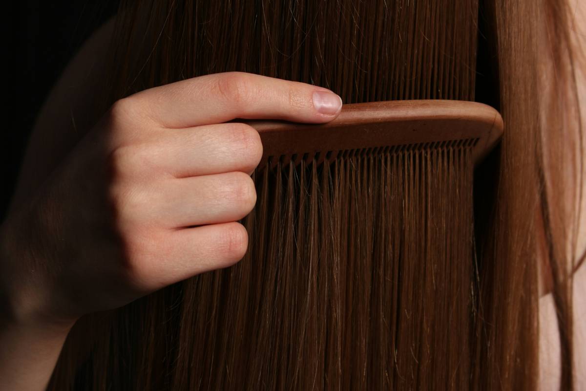 Woman with neat hair twists showing healthy scalp and no tension, demonstrating Hair Growth Support
