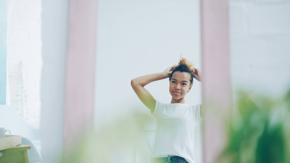 Hair Breakage Prevention: woman gently removing twists showing minimal shedding